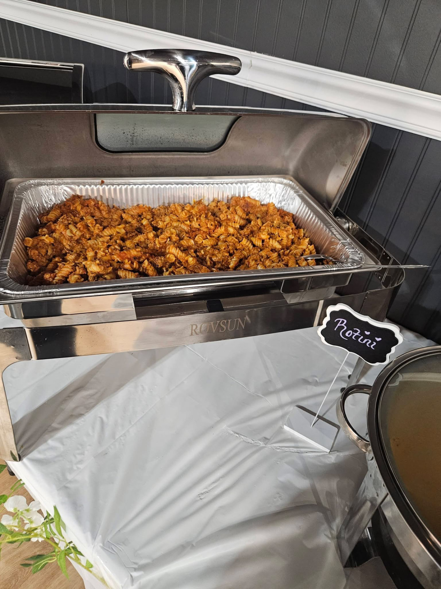 Chafing dish of Cater It rotini pasta with meat sauce